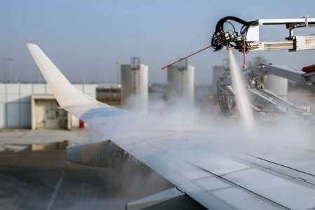De-icing procedure of an airplane before take-offの写真素材