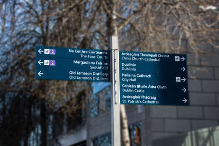 Sign showing the way to famous sights in Dublin, for example the city hall and the Dublin Castleの写真素材