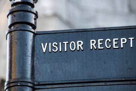 Guidepath to visitor reception with focus on the word visitorの写真素材
