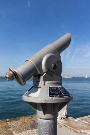 Telescope for tourists to have a better view on the sea and the sailing boatsの写真素材