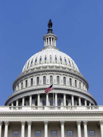 Washington State Capitol in Washington D.C.  with an american flag and the statue on the topのeditorial素材