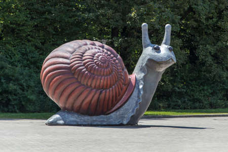 The Sweet Brown Snail is a 29 times enlargement of a snail and is 4.5 meters high, the sculpture which designed in 2002 by Jason Rhoades and Paul McCarthy and is located in front of the Deutsches Museum in Munich Traffic Centre German Museumのeditorial素材