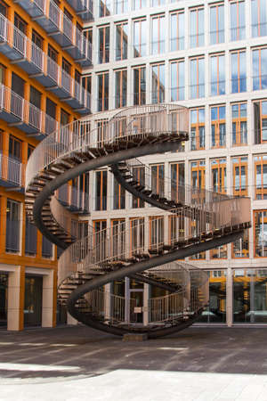 Rewriting stairs sculpture in form of a double helix with infinite stairs, the sculpture is 9 meter high and was designed by Olafur Eliasson in 2004, it is located in the courtyard of the KPMG office buildingのeditorial素材