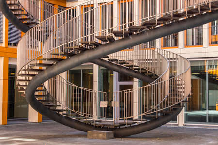 Rewriting stairs sculpture in form of a double helix with infinite stairs, the sculpture is 9 meter high and was designed by Olafur Eliasson in 2004, it is located in the courtyard of the KPMG office buildingのeditorial素材