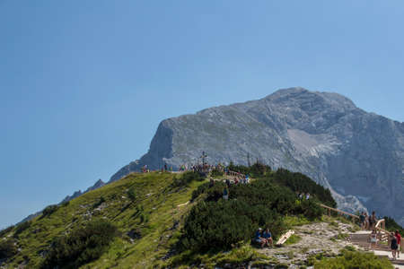 People walking to the summit cross on top of the Kehlstein, Obersalzberg close to Berchtesgaden in Bavariaのeditorial素材