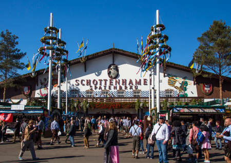Facade and entrance of the Schottenhamel beer tent with people standing in frontのeditorial素材