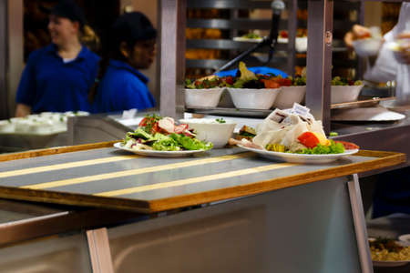 Inside the Braeurosl beer tent at the kitchen area with meals being preparedのeditorial素材