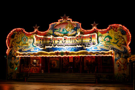 Nightshot of the Revue der Illusionen building on Theresienwiese, an entertainment show during Oktoberfestのeditorial素材