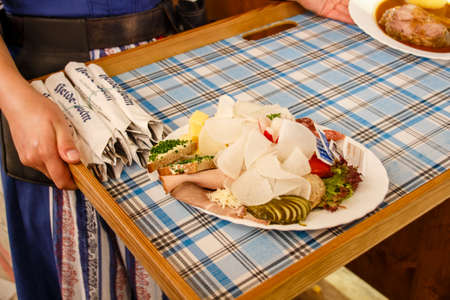 Inside the Braeurosl beer tent at the kitchen area with meals being preparedのeditorial素材