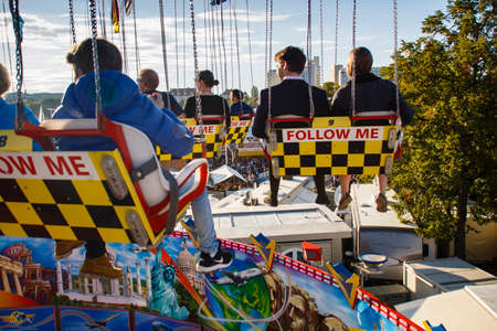 Carousel in motion with people flying through the air on Theresienwieseのeditorial素材