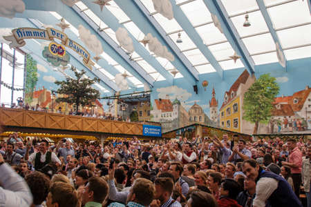 Inside the Hacker Festzelt (Himmel der Bayern) at Oktoberfest with its lovely decoration of the roof and the surrounding wallsのeditorial素材