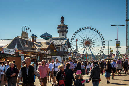 Main street on Theresienwiese fairground leading to the fun fair areaのeditorial素材