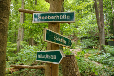 Guidepost in the forest near Roemhild showing the way to the Seeberhuette, to the museum and to the...