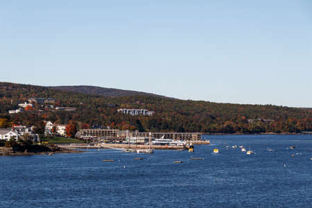 The port of Bar Harbor (Maine, USA) with a large ship for whale watching and two yellow ship's tender boatsのeditorial素材