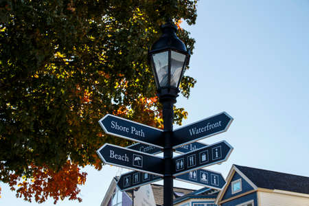 Guidepost in the port of Bar Harbor (Maine, USA) showing the way to the waterfront and the beach areaの写真素材