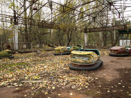 Former amusement park with bumper cars in Pripyat, the ghost town in the Chernobyl Exclusion Zone which was established after the nuclear disasterの写真素材