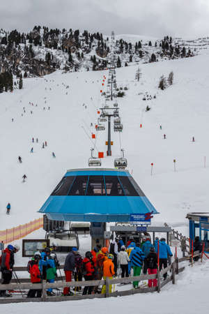 The ski lift Nordhangbahn at the Horberg mountain in Tyrol, Austria with people in the queue for a lift to the mountaintopのeditorial素材