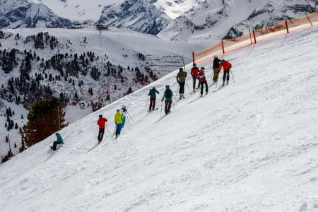 Group of people waiting prior downhill skiing on a black piste at the Horberg mountain in Tyrol, Austriaのeditorial素材