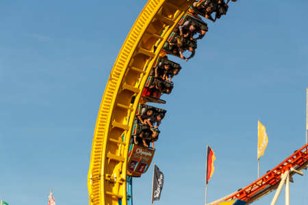 Munich, Germany - September 24, 2016: The Olympia Looping rollercoaster at Oktoberfest is a famous fun ride and attracts many peopleのeditorial素材