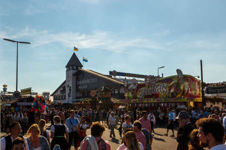 Munich, Germany - September 24, 2016: Armbrustschuetzenzelt with unidentified people on the main street walking byのeditorial素材