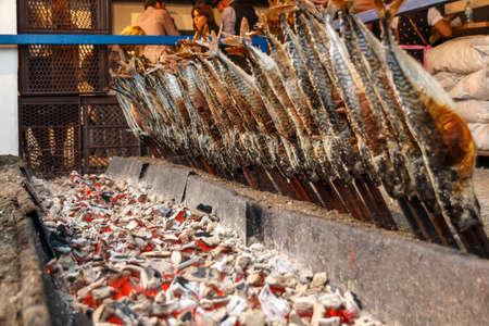 Munich, Germany - September 24, 2016: Fireplace of the Fischer Vroni tent on the Theresienwiese during Oktoberfest with it's famous fish on a stickのeditorial素材