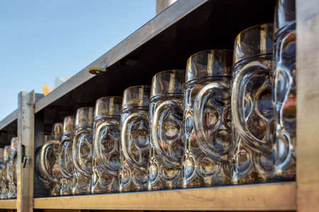Munich, Germany - September 24, 2016: Behind the scenes of the Oktoberfest in the beer garden of the Ochsenbraterei with beer steins being cleaned and preparedのeditorial素材