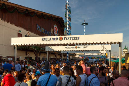 Munich, Germany - September 24, 2016: Facade and entrance of the Winzerer Faehndl beer tent with unidentified people standing in frontのeditorial素材