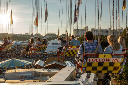 Munich, Germany - September 24, 2016: Carousel in motion with people flying through the air on Theresienwieseのeditorial素材