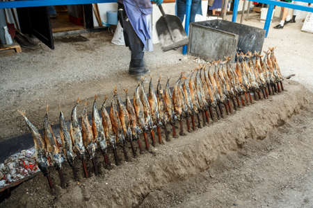 Munich, Germany - September 24, 2016: Fireplace of the Fischer Vroni tent on the Theresienwiese during Oktoberfest with it's famous fish on a stickのeditorial素材
