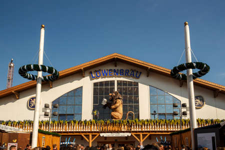 Munich, Germany - September 24, 2016: Facade and entrance of the Loewenbraeu beer tent with people standing in frontのeditorial素材
