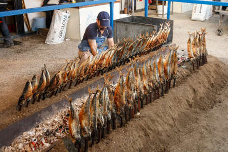 Munich, Germany - September 24, 2016: Fireplace of the Fischer Vroni tent on the Theresienwiese during Oktoberfest with it's famous fish on a stickのeditorial素材