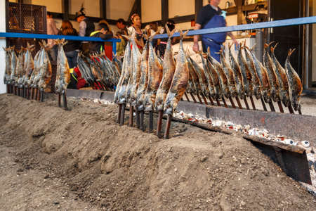 Munich, Germany - September 24, 2016: Fireplace of the Fischer Vroni tent on the Theresienwiese during Oktoberfest with it's famous fish on a stickのeditorial素材