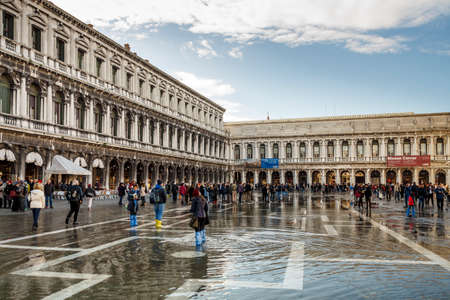 Venice, Italy - November 12, 2016: The St. Mark's Square with its main landmarks is the principal public square of Venice and attracts many touristsのeditorial素材