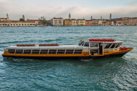 Venice, Italy - November 12, 2016: Lagoon of Venice with it characteristic cityscape and motorboats in front that are used for passenger transportsのeditorial素材
