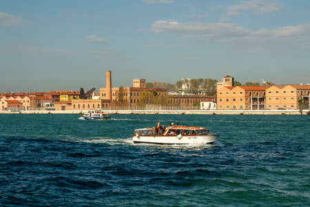 Venice, Italy - November 12, 2016: Water taxi commuting in the canals of Venice, motorboats are the common way of travelingのeditorial素材