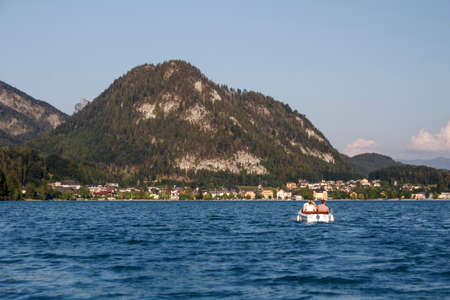 The Fuschlsee during summer season with it's beautiful surrounding landscape and buildings of the...