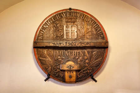 Munich, Germany - September 26, 2015: Wooden sign in the Hofbraeuhaus in Munich close to the...