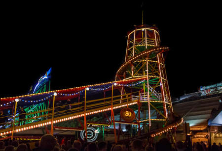 Munich, Germany - September 26, 2015: Nightshot of the famous Toboggan building with the conveyor beltのeditorial素材