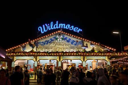 Munich, Germany - September 26, 2015: Nightshot of the Wildmoser Huehner & Entenbraterei building on Theresienwieseのeditorial素材