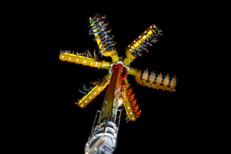 Munich, Germany - September 26, 2015: Skater fun ride in motion with people flying through the air on Theresienwieseのeditorial素材