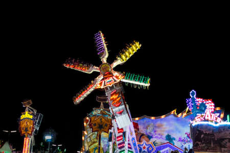 Munich, Germany - September 26, 2015: Skater fun ride in motion with people flying through the air on Theresienwieseのeditorial素材