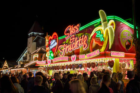 Munich, Germany - September 26, 2015: Sales stall for takeaway food (gingerbread hearts and others) at Oktoberfestのeditorial素材