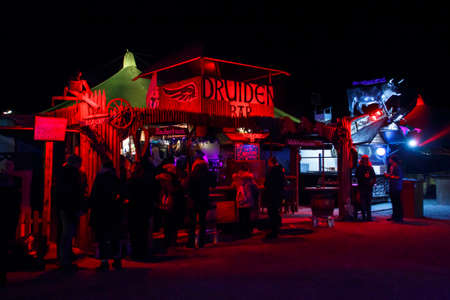 Munich, Germany - November 30, 2016: Tollwood winter festival and christmas market in Munich during the evening hours with illuminated barsのeditorial素材