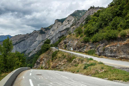 L'Alpe d'Huez, France - August 19, 2019: Ascent of the famous climb to L'Alpe d'Huez and itinerary of the Tour de France at bend 20のeditorial素材