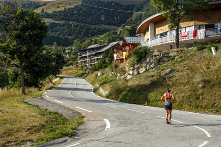 L'Alpe d'Huez, France - August 19, 2019: Chalets at the famous climb to L'Alpe d'Huez and itinerary of the Tour de Franceのeditorial素材