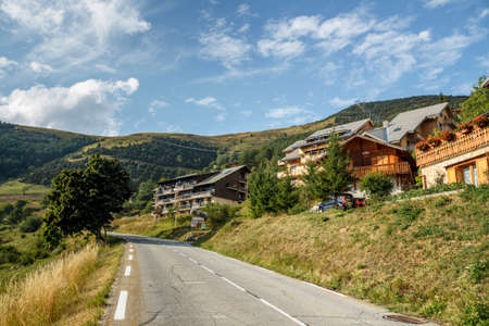 L'Alpe d'Huez, France - August 19, 2019: Chalets at the famous climb to L'Alpe d'Huez and itinerary of the Tour de Franceのeditorial素材