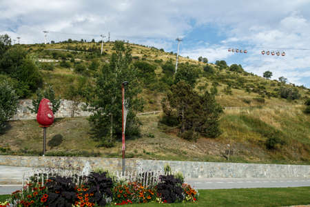L'Alpe d'Huez, France - August 19, 2019: Ski resort L'Alpe d'Huez in summer with flowers at the...