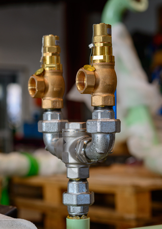 Nice contrast between steel and brass in piping constructionの写真素材