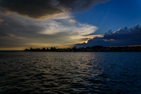 The nights at Lake Constance in Summer are famous for the warm and really calm air.But when thunderstorms are emerging there is a lot of energy in the Skyの写真素材