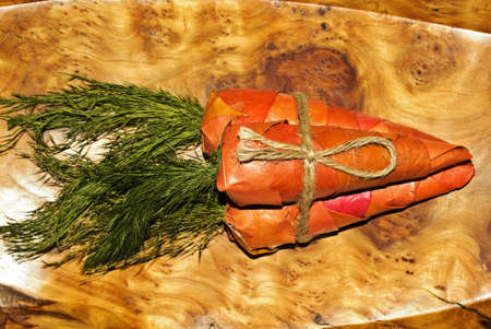 An unusual gift of three carrots made from vine leavesの写真素材